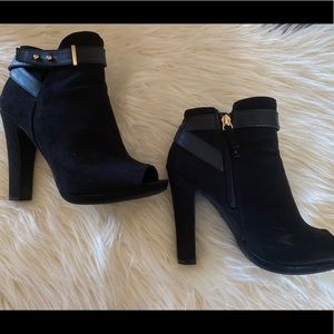 Black semi-chunky heeled bootie with gold hardware